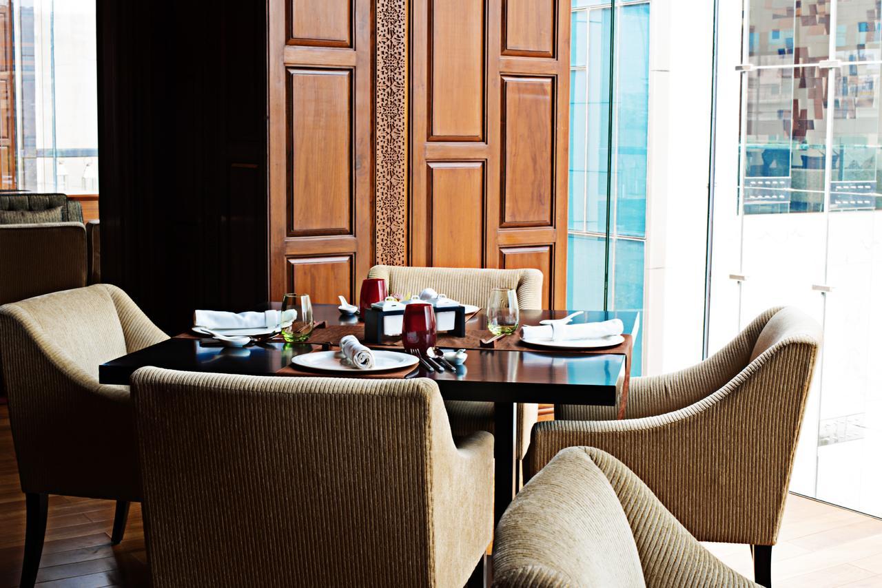 Taj City Centre Gurugram Gurgaon Exterior foto A dining room
